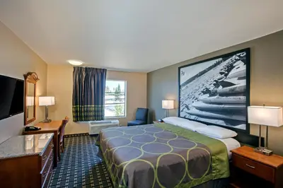 a hotel room with a bed and a flat screen tv at The Hotel 39 in Westminster