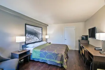 a hotel room with a bed and a tv at The Hotel 39 in Westminster
