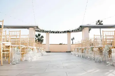 a wedding aisle with chairs and a marquee at Redondo Beach Hotel, Tapestry Collection by Hilton in Redondo Beach