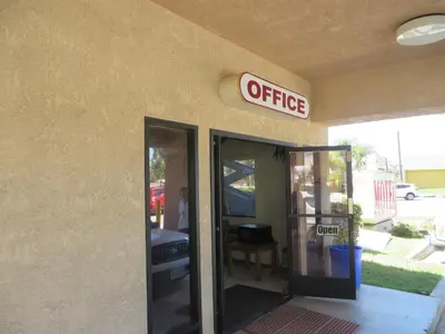an office sign on the side of a building at Mountain Inn in Ontario