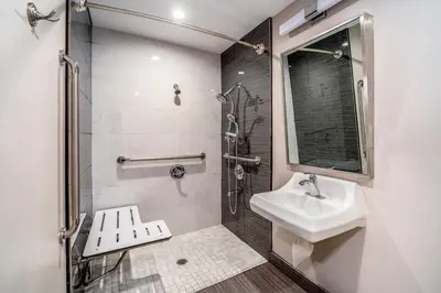 a bathroom with a sink and a shower at Friendly Hills Inn - Whittier, Los Angeles in Whittier