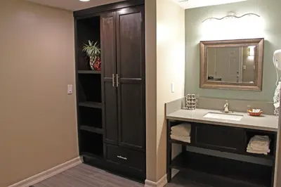 a bathroom with a sink and a mirror at Friendly Hills Inn - Whittier, Los Angeles in Whittier