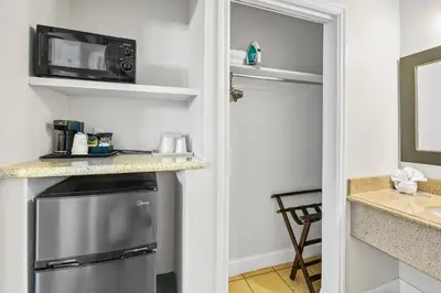 a kitchen with a refrigerator and a microwave at Vagabond Inn Whittier in Whittier