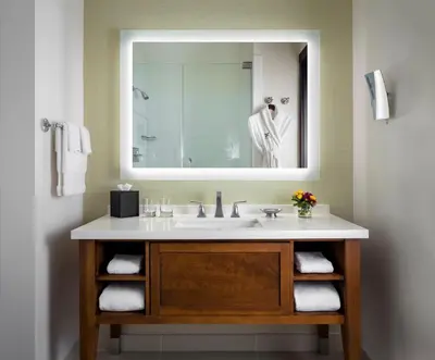 a bathroom with a sink and a mirror at Ambrose Hotel in Los Angeles