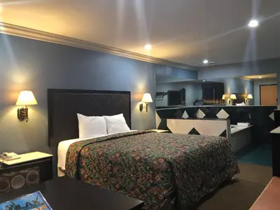 a hotel room with a bed and a kitchen at La Mirage Inn LAX Airport in Los Angeles