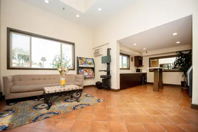 a living room with a couch and a table at Casa Bella Inn- Huntington Park in Huntington Park