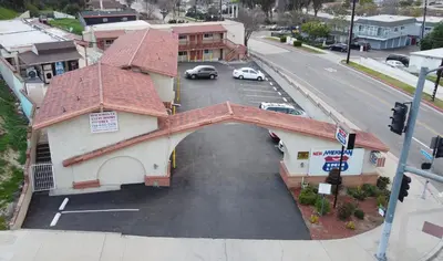 an overhead view of a building with a parking lot at New American Inn & Suites in Anaheim