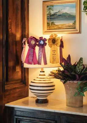 a lamp on a table with ribbon bows on it at Palihotel Melrose in Los Angeles