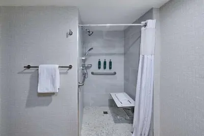 a bathroom with a shower with a shower curtain at DoubleTree by Hilton Chatsworth in Chatsworth