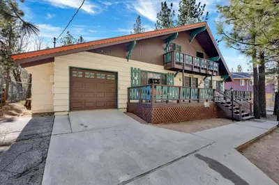 a house with a balcony and a garage at Moose Creek Chalet-1237 by Big Bear Vacations in Big Bear Lake
