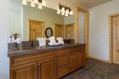 a bathroom with two sinks and a large mirror at Eagle Ridge Views-1648 by Big Bear Vacations in Big Bear Lake