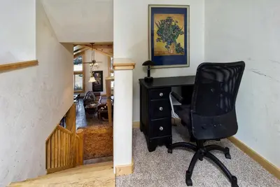 a black chair sitting in a room with a desk at Eagle Ridge Views-1648 by Big Bear Vacations in Big Bear Lake