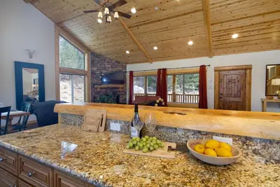 a kitchen with a counter with a bowl of fruit at Eagle Ridge Views-1648 by Big Bear Vacations in Big Bear Lake