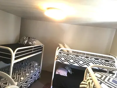 a room with two bunk beds and a ceiling at Sequoia National Forest CabinG in Panorama Heights