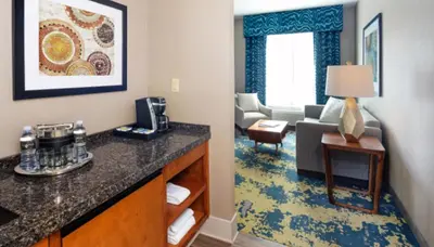 a hotel room with a living room with a living room at Bear Springs Hotel in Highland