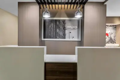 a dressing room with a bench and a window at Hampton Inn & Suites Los Angeles/Hollywood, CA in Los Angeles