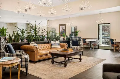 a living room with a couch and a table at Chateau Big Bear Boutique Hotel, BW Signature Collection in Big Bear Lake