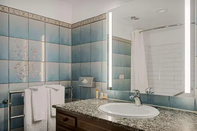 a bathroom with a sink and a mirror at Chateau Big Bear Boutique Hotel, BW Signature Collection in Big Bear Lake