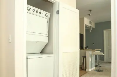 a kitchen with a white oven in a room at Amazing Apartments near the grove in Los Angeles