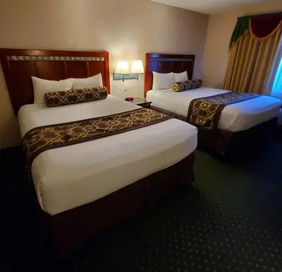 a hotel room with two beds in a room at Triplodge of Santa Clarita in Santa Clarita