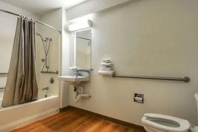 a bathroom with a toilet and a sink and a shower at Motel 6-Westminster, CA - South - Long Beach Area in Westminster