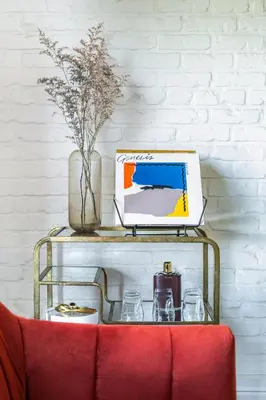 a table with a laptop computer on top of a shelf at Gold-Diggers in Los Angeles
