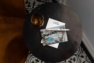 a table with a book and a ticket and a pen at Cuyama Buckhorn in New Cuyama