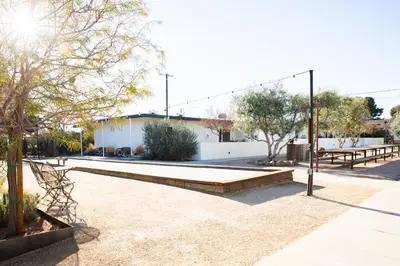 a park with benches and picnic tables and trees at Cuyama Buckhorn in New Cuyama