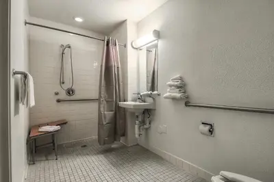a bathroom with a sink and a shower at Motel 6-Fontana, CA in Fontana