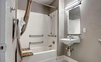 a bathroom with a sink and a tub and a toilet at Motel 6-Bakersfield, CA - South in Bakersfield