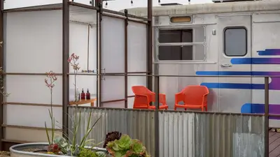 a house with two chairs and a train at Waypoint Ventura in Ventura