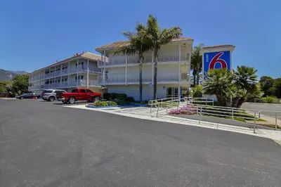a hotel with a parking lot in front of it at Motel 6-Carpinteria, CA - Santa Barbara - North in Carpinteria
