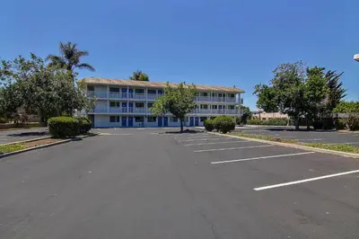 an empty parking lot in front of a building at Motel 6-Carpinteria, CA - Santa Barbara - North in Carpinteria