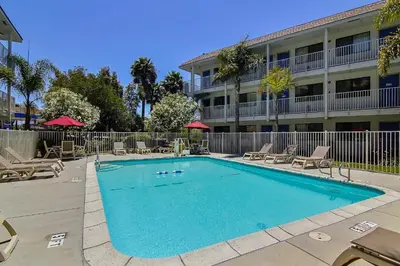a swimming pool in front of a building at Motel 6-Carpinteria, CA - Santa Barbara - North in Carpinteria