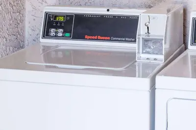 a microwave oven sitting on top of a counter at Days Inn by Wyndham Castaic Six Flags Magic Mountain in Castaic