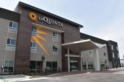 a building with a sunvisor on the side of it at La Quinta Inn & Suites by Wyndham San Bernardino in San Bernardino