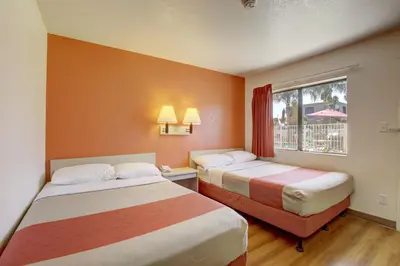 a hotel room with two beds and a window at Motel 6-Corona, CA in Corona