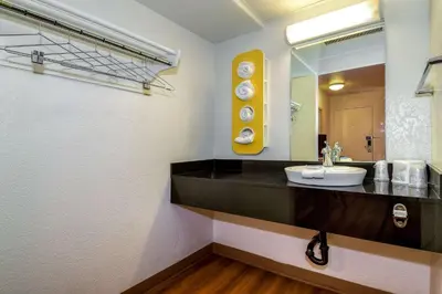 a bathroom with a sink and a mirror at Motel 6-Corona, CA in Corona