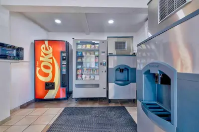 a cocacola machine in a store with a drink cooler at Motel 6-Anaheim, CA - Fullerton East in Anaheim