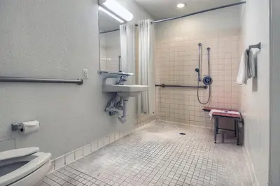 a bathroom with a sink and a shower and a toilet at Motel 6 Chino, CA - Los Angeles Ontario in Chino