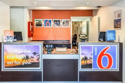 an office with a reception desk with a light on for you at Motel 6-Bakersfield, CA - East in Bakersfield