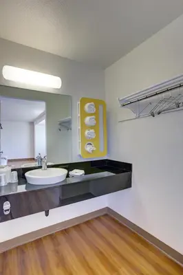 a bathroom with a sink and a mirror at Motel 6-Bellflower, CA - Los Angeles in Bellflower