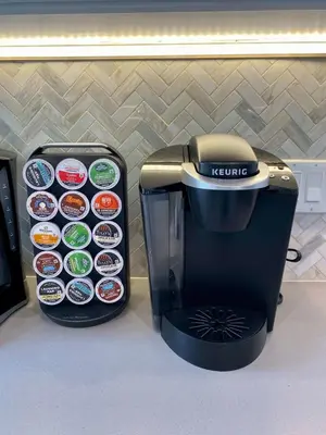 a kreme coffee maker next to a coffee machine at Oasis with pool and music studio by BENVENU in Los Angeles