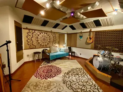 a living room with a couch and a table at Oasis with pool and music studio by BENVENU in Los Angeles