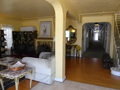 a living room with a white couch and a table at Hotel del Flores in Los Angeles