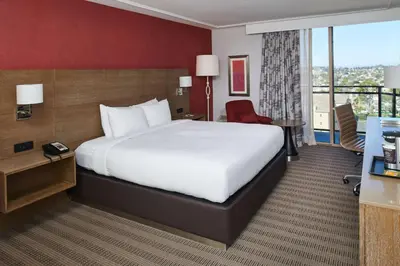 a hotel room with a large bed and a desk at DoubleTree by Hilton Torrance - South Bay in Torrance