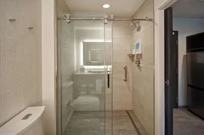 a bathroom with a shower with a toilet and a sink at Home2 Suites by Hilton Los Angeles Montebello in Montebello