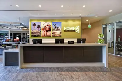 a lobby with a large poster on the wall at Home2 Suites by Hilton Los Angeles Montebello in Montebello