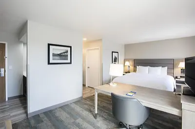 a hotel room with a bed and a desk at Hampton Inn & Suites Hermosa Beach in Hermosa Beach