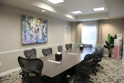 a conference room with a large table and chairs at Hilton Garden Inn Calabasas in Calabasas